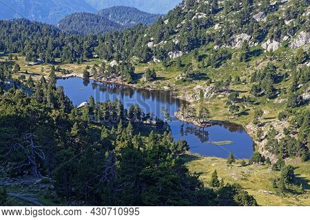 Top View Of Still Waters Of Achard Lake With Reflections