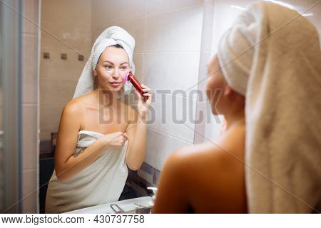 Portable Electroporation. Skin Care Lifting Spa And Cosmetology At Home. The Girl Makes Microcurrent