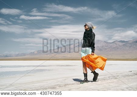 Asian Woman Female Tourist In Long Skirt Walking On Saline Alkali Land