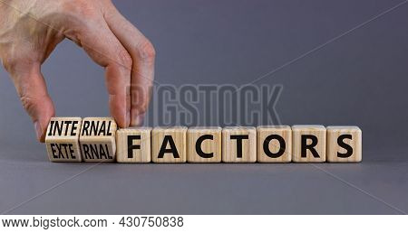 External Or Internal Factors Symbol. Businessman Turns Cubes, Changes Words External Factors To Inte