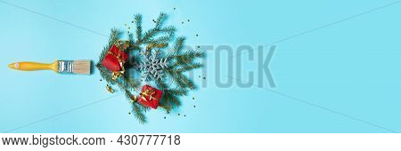 Creative Composition Christmas And New Year. Paint Brush With Christmas Fir And Ornaments On A Red B