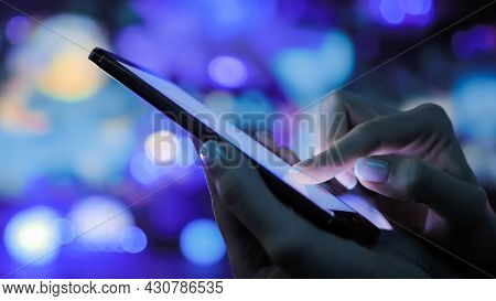 Close Up Side View: Woman Hands Using Smartphone Device At Interactive Exhibition Or Museum With Col