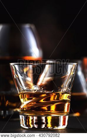 Strong Alcohol Drinks, Hard Liquors, Spirits And Distillates In Glasses: Cognac, Scotch, Whiskey And