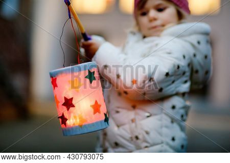 Close-up Of Little Kid Girl Holding Selfmade Lanterns With Candle For St. Martin Procession. Healthy