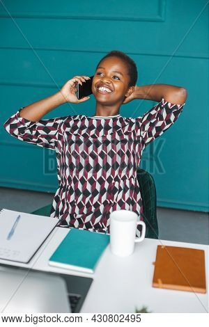 Office Worker. Beautiful American Portrait Of Black Businesswoman At Home Talking On Phone Beautiful