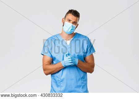 Healthcare Workers, Covid-19, Coronavirus And Preventing Virus Concept. Handsome Tired Doctor, Male 