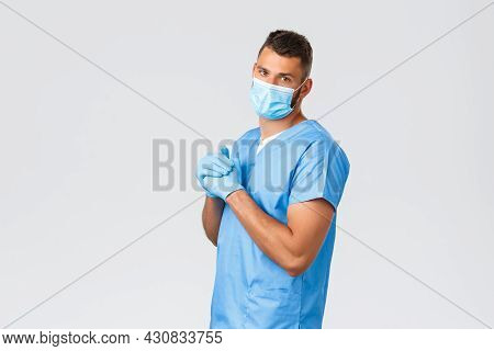 Healthcare Workers, Covid-19, Coronavirus And Preventing Virus Concept. Handsome Doctor, Male Nurse 