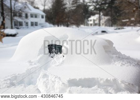 Vehicle Covered With Snow In Winter Blizzard. Cars In Snowdrifts After A Snowfall. After The Winter 