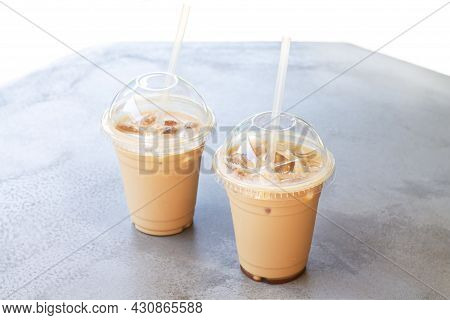 Two Iced Coffee Or Latte In Take Away Plastic Cup On Street Cafe Stone Table