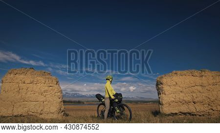 The Woman Travel On Mixed Terrain Cycle Touring With Bikepacking. The Traveler Journey With Bicycle 