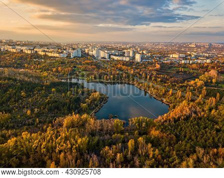 Aerial View Of A Lake In A Park With Autumn Trees. Kishinev, Moldova. Epic Aerial Flight Over Water.