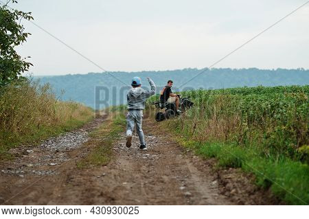 Man Driving Four Wheller Atv Quad Bike.