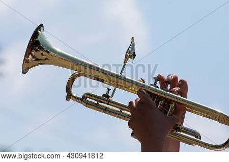 Playing A Brass Instrument. Military Band Performs At The Festival