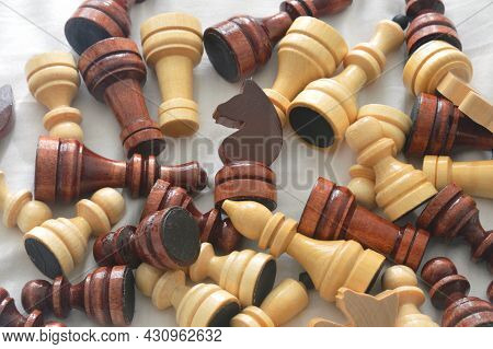 Wooden Chess Pieces On White Background Close Up.
