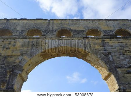 Arch of the Pont du Gard, ancient Roman aqueduct bridge build in the 1st century AD
