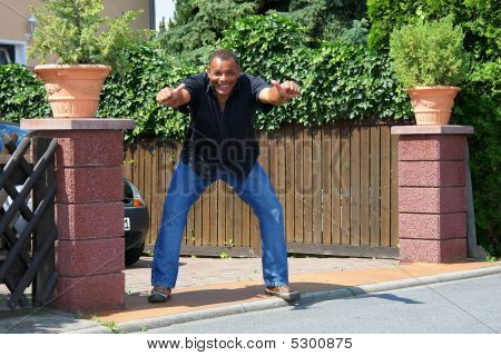 Successful And Powerful African American In Front Of His House