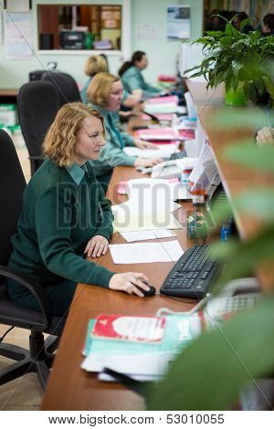 MOSCOW - FEB 28: Four women in uniform working in office in Kiev customs house on February 28, 2013 in Moscow, Russia.