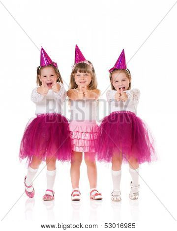 Cute little girls showing thumbs up, isolated on white background
