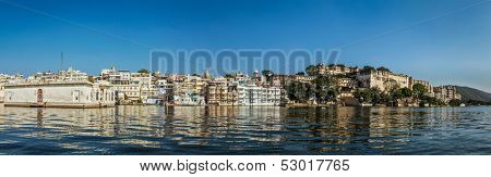 India luxury tourism concept background - panorama of Udaipur City Palace from Lake Pichola. Udaipur, India