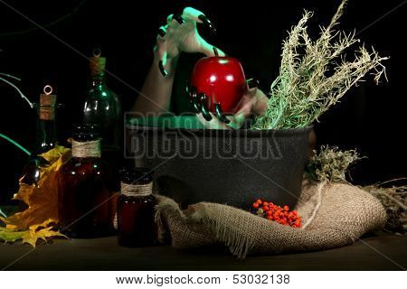  Witch in scary Halloween laboratory on dark color background