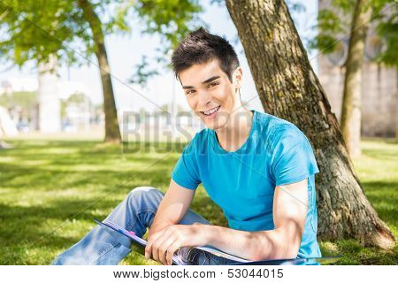Happy Student Studying At The School Garden