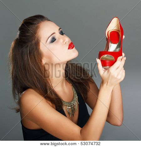 Brunette Woman Holding Red High Heels