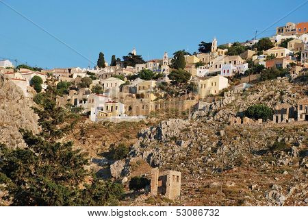 Looking up towards the old village of Chorio from the port of Yialos on the Greek island of Symi.