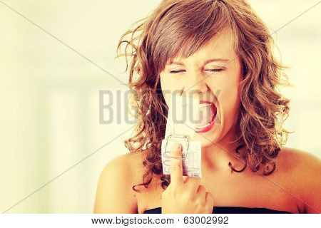 Screaming woman after geting traped by mouse trap with 500 euro