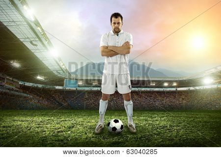 Soccer player with ball in action outdoors.