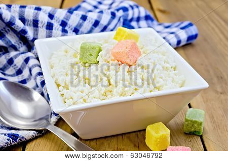 Curd With Colored Sugar And Spoon On Board