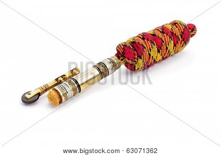 closeup of an old spanish lighter called mechero on a white background