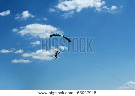 Unidentified Skydiver On Blue Sky
