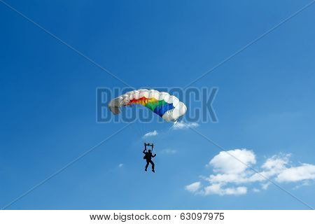 Unidentified Skydiver On Blue Sky