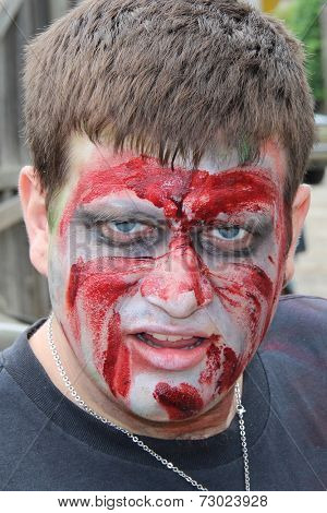 MUSKOGEE, OK - Sept. 13: A very bloody zombie waits for runners during the Castle Zombie Run at the Castle of Muskogee in Muskogee, OK on September 13, 2014. 