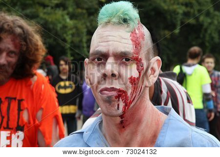 MUSKOGEE, OK - Sept. 13: A very bloody zombie waits for runners during the Castle Zombie Run at the Castle of Muskogee in Muskogee, OK on September 13, 2014. 