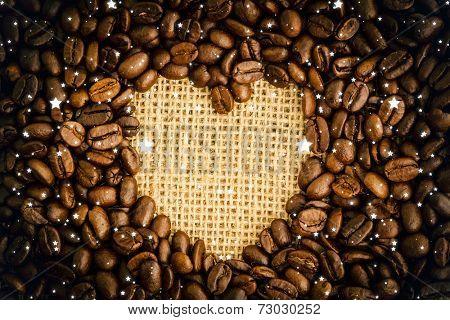 Snow against heart indent in coffee beans