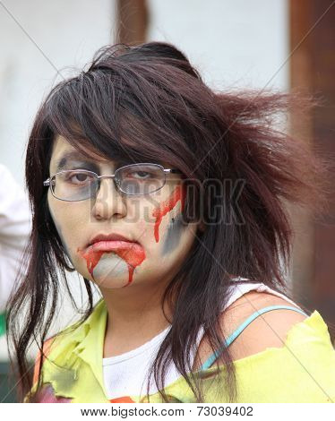 MUSKOGEE, OK - Sept. 13: A bloody zombie looks waits for runners during the Castle Zombie Run at the Castle of Muskogee in Muskogee, OK on September 13, 2014. 