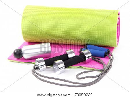 Sports requisites on sport mat isolated on white
