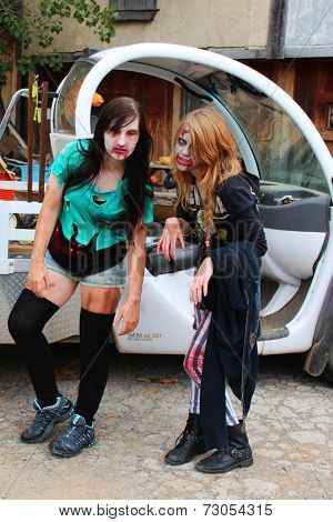 MUSKOGEE, OK - Sept. 13: Bloody zombies wait for runners to attack during the Castle Zombie Run at the Castle of Muskogee in Muskogee, OK on September 13, 2014. 