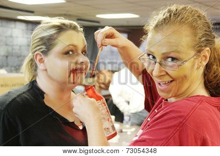 MUSKOGEE, OK - Sept. 13: Actors get make-up to look like zombies for the Castle Zombie Run at the Castle of Muskogee in Muskogee, OK on September 13, 2014. 