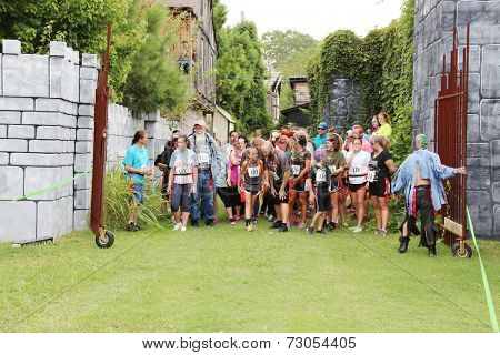 MUSKOGEE, OK - Sept. 13: Runners wait for the start of second annual Castle Zombie Run at the Castle of Muskogee in Muskogee, OK on September 13, 2014. 