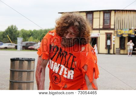 MUSKOGEE, OK - Sept. 13: Bloody zombies wait for runners to attack during the Castle Zombie Run at the Castle of Muskogee in Muskogee, OK on September 13, 2014. 