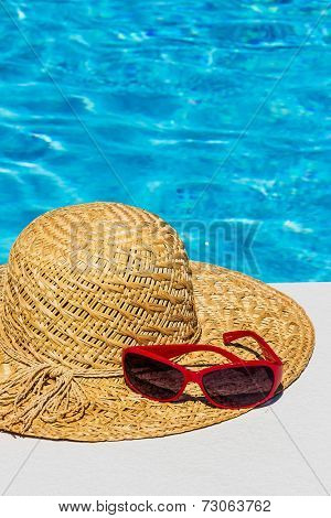 utensils for a nice and relaxing vacation day lying next to a swimming pool. relaxation on holiday.