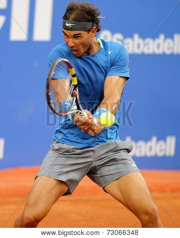 BARCELONA - APRIL, 24: Spanish tennis player Rafa Nadal in action during a match of Barcelona tennis tournament Conde de Godo on April 24, 2014 in Barcelona