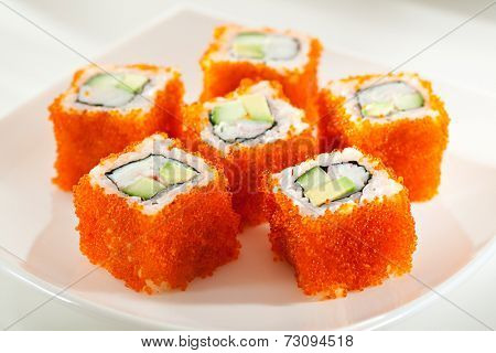 California Maki Sushi with Masago  - Roll made of Crab Meat, Avocado, Cucumber inside. Smelt roe outside