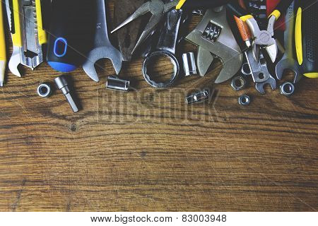 set of tools on wood board background