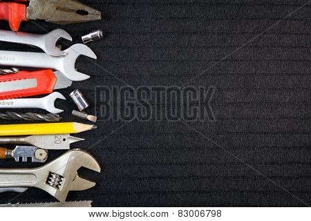 Set of tools on black background