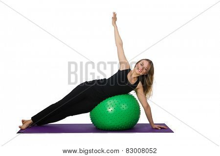 Young woman exercising with swiss ball