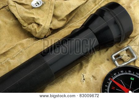 Pocket Searchlight And Compass On Backpack