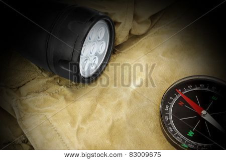 Pocket Searchlight And Compass On Backpack